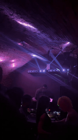 DJ performs at brick-ceiling nightclub in Turin early morning