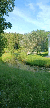 Visitor documents afternoon stroll through historic Pavlovsk Park, Russia