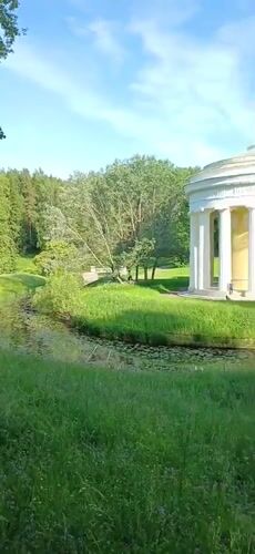 Visitor documents afternoon stroll through historic Pavlovsk Park, Russia