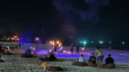 Fire dancers perform evening beach show in Langkawi Malaysia