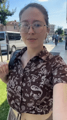 Woman films selfie video while walking in Podgorica
