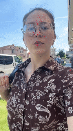 Woman films selfie video while walking in Podgorica