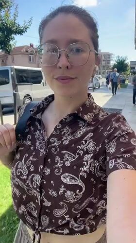 Woman films selfie video while walking in Podgorica