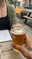 Two people share outdoor drinks in New Windsor