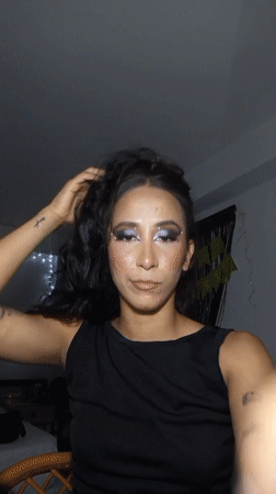 Woman in elaborate purple makeup documented in Porlamar morning session