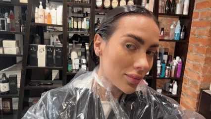 Woman documents hair salon visit in Warsaw