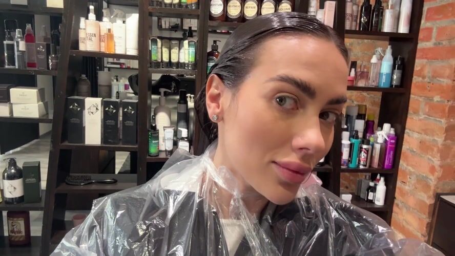 Woman documents hair salon visit in Warsaw