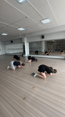 Dancers practice floor routines in Votkinsk studio