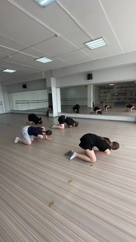 Dancers practice floor routines in Votkinsk studio