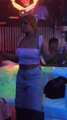 Inside a neon-lit nightclub: dancing, socializing, house rules posted