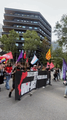 Protesters march through Barcelona streets carrying banners
