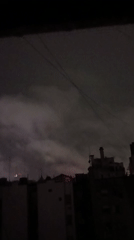 Buenos Aires skyline captured under overcast night sky