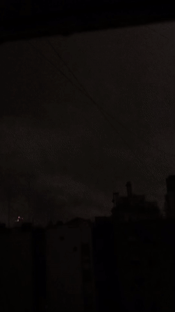 Buenos Aires skyline captured under overcast night sky