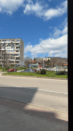 Horse-drawn cart carries three passengers through Varna streets
