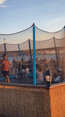 Sunset dining and children's play at Bar Montenegro beachside restaurant