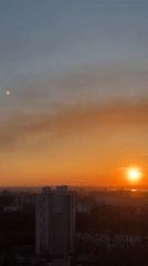 Sunset observed across Perm, Russia with atmospheric haze present