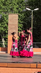 Flamenco and group dance routines on an outdoor Cornellà stage