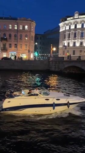 Classic Jaguar and nighttime river scenes in Saint Petersburg