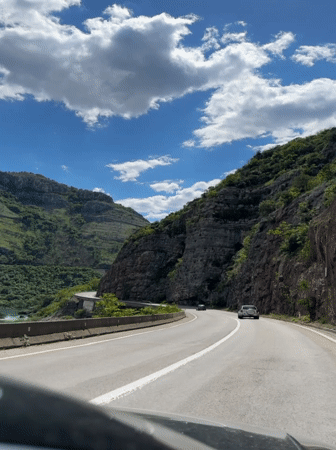 Mountain road documented in sunny Montenegro landscape