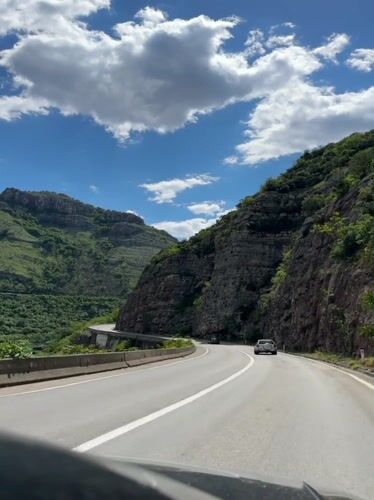 Mountain road documented in sunny Montenegro landscape