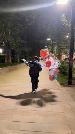 Evening scenes in Yerevan: balloon vendor, video call