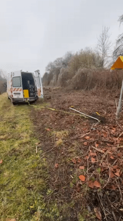 Van with open doors, cable spotted in Douai field