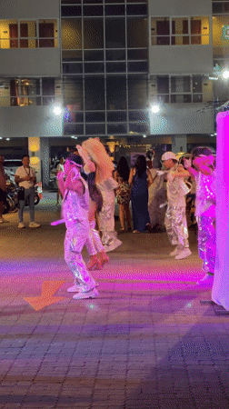 Drag queens perform outdoor dance in silver costumes, Kathu