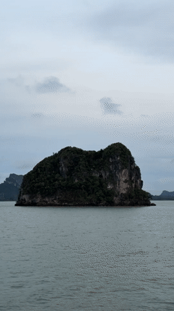 Overcast seascape with rocky islands filmed near Don Sak, Thailand