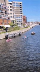 Sunny afternoon brings busy recreational canal activity to Alkmaar
