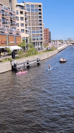 Sunny afternoon brings busy recreational canal activity to Alkmaar
