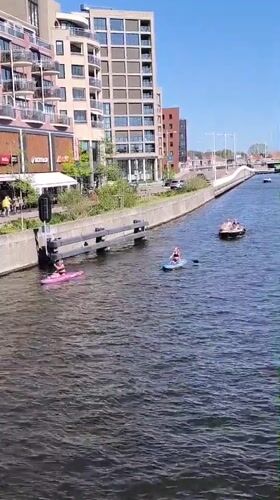 Sunny afternoon brings busy recreational canal activity to Alkmaar