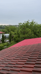 Rain shower observed from rooftop perspective in Zornitsa, Bulgaria