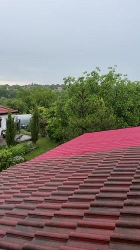 Rain shower observed from rooftop perspective in Zornitsa, Bulgaria