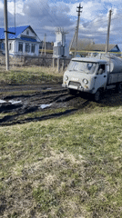 Vehicles navigate muddy rural roads in Новая Шемурша, Russia