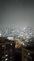 Heavy rain documented in nighttime Caracas cityscape footage
