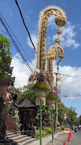 Traditional penjor ceremonial poles observed on Ubud street