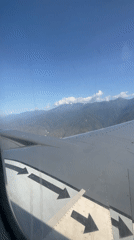 Aerial view captured from airplane window over Caraballeda, Venezuela