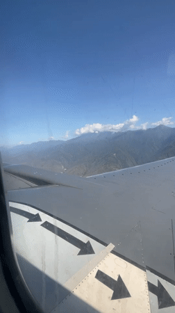 Aerial view captured from airplane window over Caraballeda, Venezuela