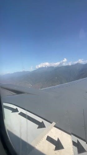 Aerial view captured from airplane window over Caraballeda, Venezuela