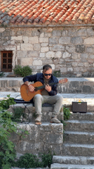 Street musician and tourist activities observed in Budva Montenegro