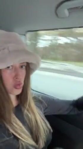 Woman photographed in vehicle traveling through French Alps region