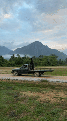 Hot air balloons and paramotors take off in Vang Vieng