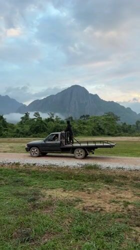 Hot air balloons and paramotors take off in Vang Vieng