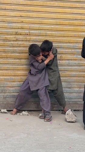 Kids, a puppy, and a makeshift Ferris wheel in Quetta