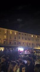Young adults gather for outdoor night event in Turin