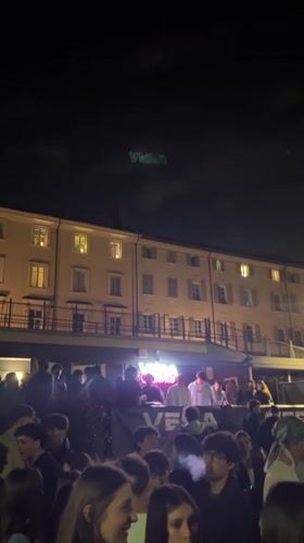 Young adults gather for outdoor night event in Turin