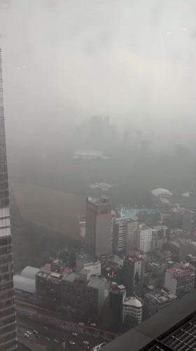Dense fog blankets Mexico City during evening rainstorm