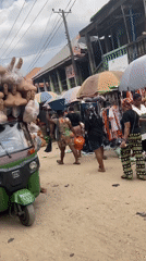 Nigerian market vendors conduct daily business in Umuode, Aba