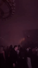 Moscow nightclub gathering features red lighting and fog effects