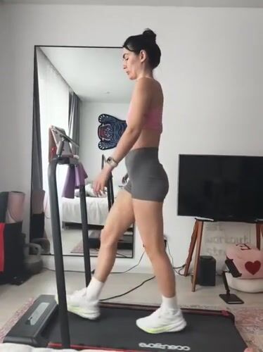Woman exercises on treadmill in Tyumen gym facility